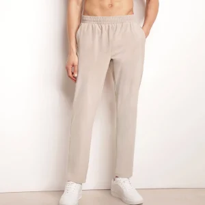 Pantalón deportivo chino para hombre en punto elástico beis Dim Move